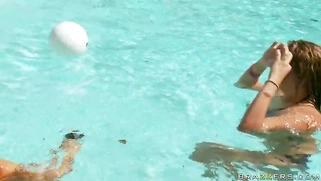 Exotic chick Abella Anderson swimming with a guy in the pool and showing her boobs