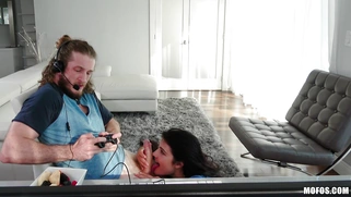 Adria Rae is sucking Brick Danger's cock as he playing video games