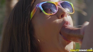 Maddy O'Reilly gives nice blowjob outdoors