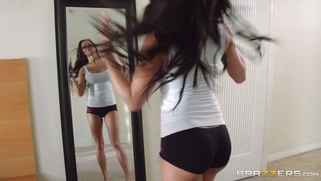 Peta Jensen in a headphones dancing nude in front of the mirror