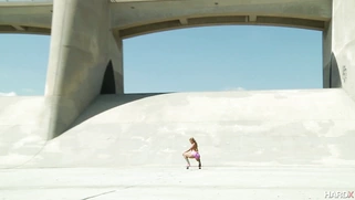 Carmen Caliente posing on the skateboard outdoor