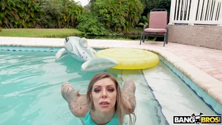 Big titted Karma Rx shows off her pussy by the pool