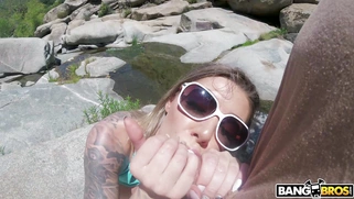 Karma Rx in sunglasses is sucking cock outdoors