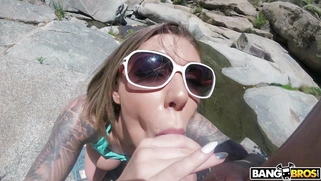 Karma Rx in sunglasses is sucking cock outdoors