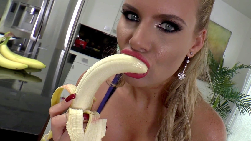 Anastasia sucks a banana