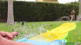 Goldie Ortiz has some fun by the pool playing on the slip n slide