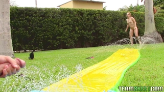 Goldie Ortiz has some fun by the pool playing on the slip n slide