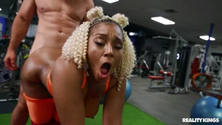 Mimi Curvaceous gets banged doggystyle by Jmac in the gym