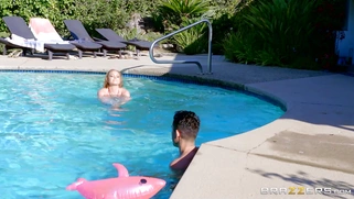 Krissy Lynn gives the lucky young man an underwater handjob