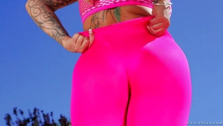 Ryan Conner poses outdoors, revealing her huge ass