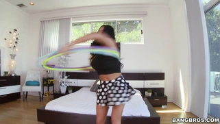 Buxom brunette Audrey Bitoni plays with the hoop