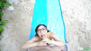 Mina Moon in glasses is sucking the cock and licking balls