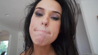 Megan Rain taking large cumshot into and around her mouth