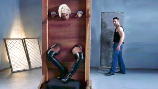 Bridgette B is put into the pillory and gets her both holes fingered