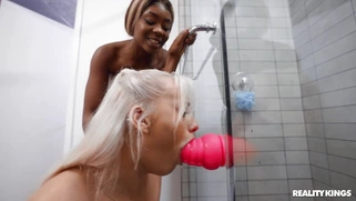 Tori Montana and Indica Monroe take turns sucking the dildo in the shower