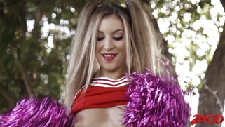 Moka Mora in cheerleader uniform flashes her panties outdoors