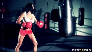 Boxer girl Aryana Augustine hitting the bag in the gym