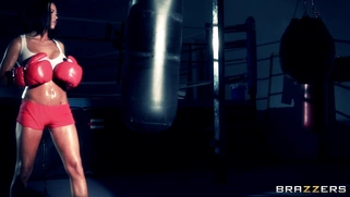 Boxer girl Aryana Augustine hitting the bag in the gym