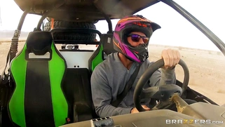 Nikki Benz whips out her juggs and has some dune buggy action in the desert