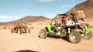 Nikki Benz whips out her juggs and has some dune buggy action in the desert