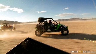 Nikki Benz whips out her juggs and has some dune buggy action in the desert