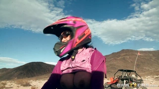 Nikki Benz whips out her juggs and has some dune buggy action in the desert