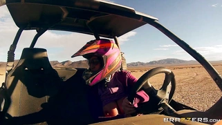 Nikki Benz whips out her juggs and has some dune buggy action in the desert