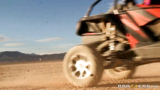 Nikki Benz whips out her juggs and has some dune buggy action in the desert