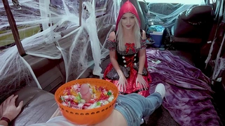 Britt Blair and Peter Green put on Halloween costumes in the BangBus