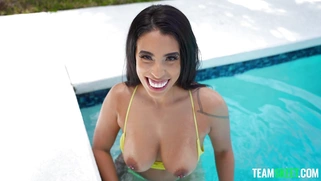 Amirah Styles is posing poolside