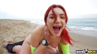 Redhead Paola Hard is riding Emilio Ardana on the beach