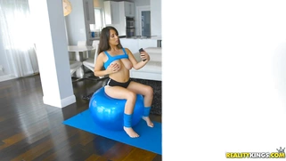 Nina Lopez bouncing up and down on a giant workout ball