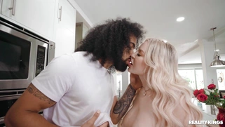 Jenna Starr is sucking black dick in the kitchen