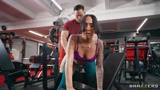Kona Jade in ripped leggings gets fucked doggystyle at the gym