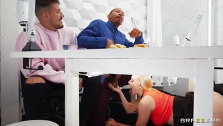 Kay Lovely is sucking black cock under the table