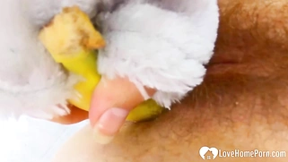 Cosplayer penetrates her hairy pussy with a banana