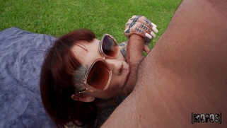 Tiger Lilly wearing sunglasses is sucking big cock outdoors