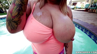 Brandy Talore plays with these huge tits in the pool