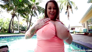 Brandy Talore plays with these huge tits in the pool