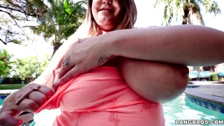 Brandy Talore plays with these huge tits in the pool