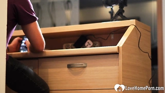 Fucking a redhead behind her working desk