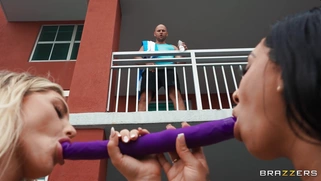Kayley Gunner and Kona Jade share the dildo outdoors