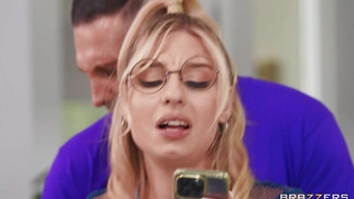 Cheerleader Kait wearing glasses is sucking two cocks