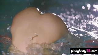 Hot swimmer posing on the starting block