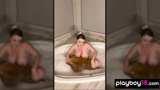 Sexy MILF taking a bath and masturbating