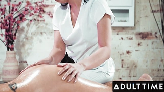 Seductive masseuse Alex Cole gives a MILF client a special massage