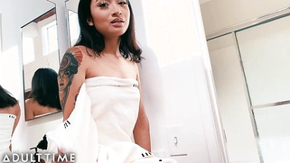 This Asian beauty fingers herself in the shower