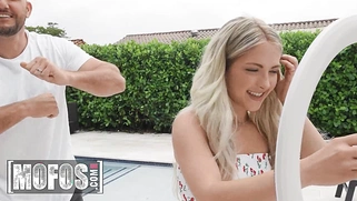 Petite Emma Bugg is stunned by JMac's cock, which is bigger than her face and as thick as her hand