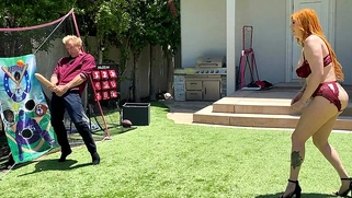 Big-booty redhead MILF plays ball with her stepson's huge white cock