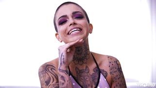 Leigh Raven shows off her split tongue and pierced tits